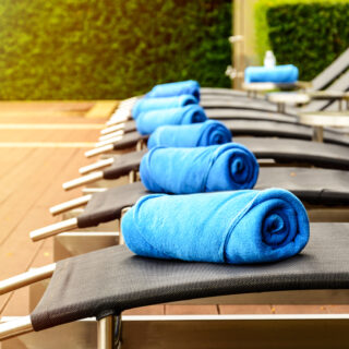 Towel on sun bed at poolside